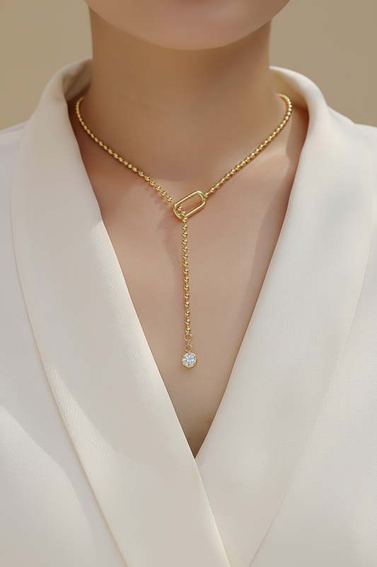 Gold plated moissanite tassel necklace on model