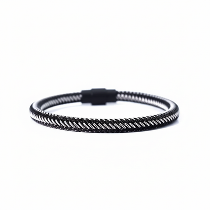 Black braided bracelet on white background