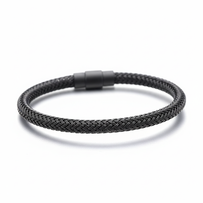 Black braided bracelet on white background