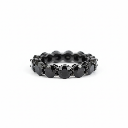 Black gemstone ring with white background