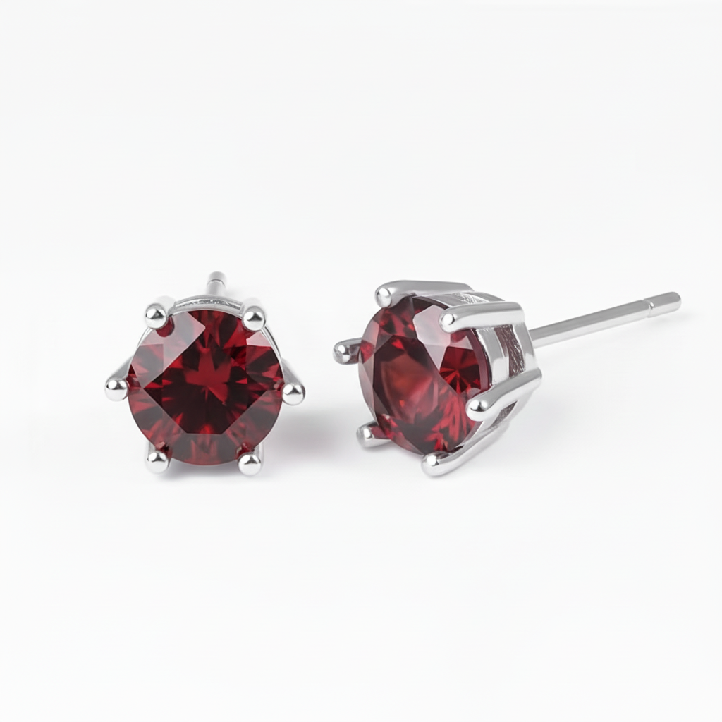 Clean garnet earrings on white background
