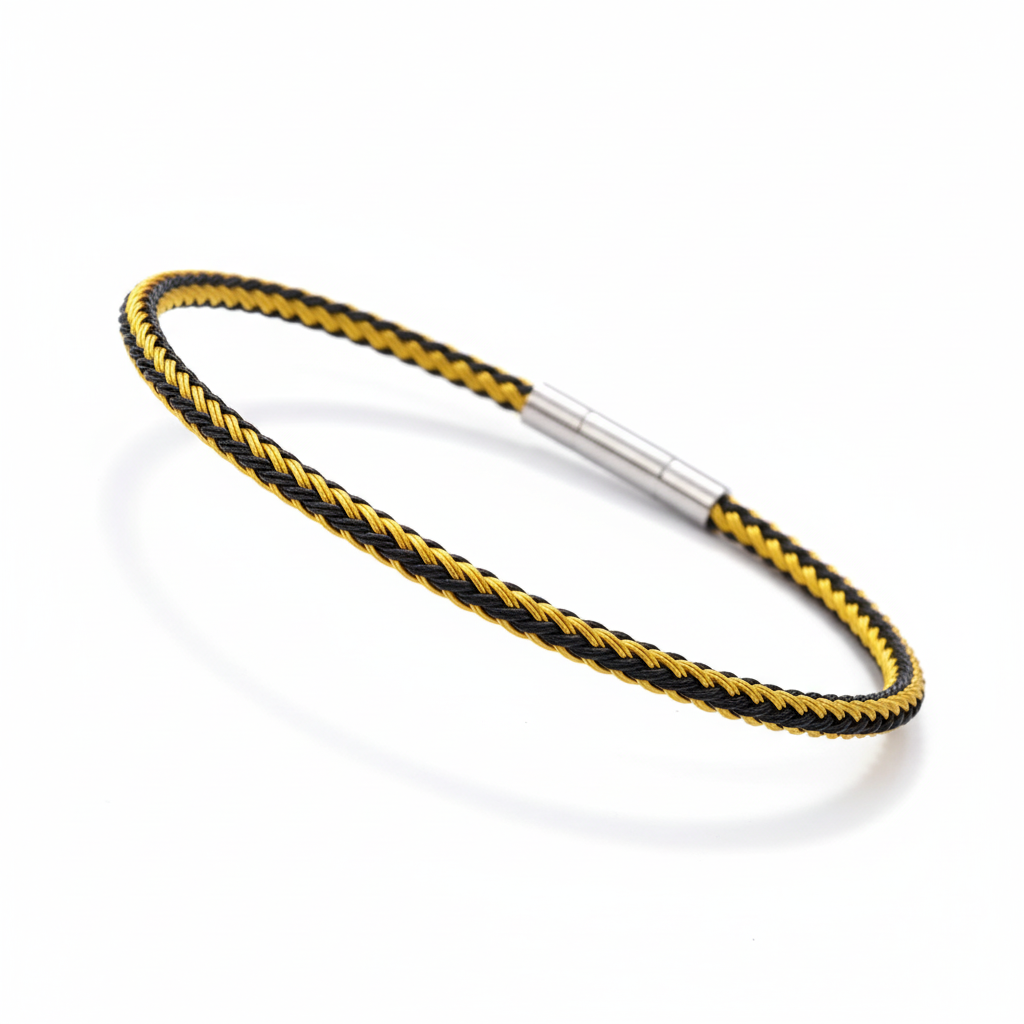 Gold and black braided bracelet on white background