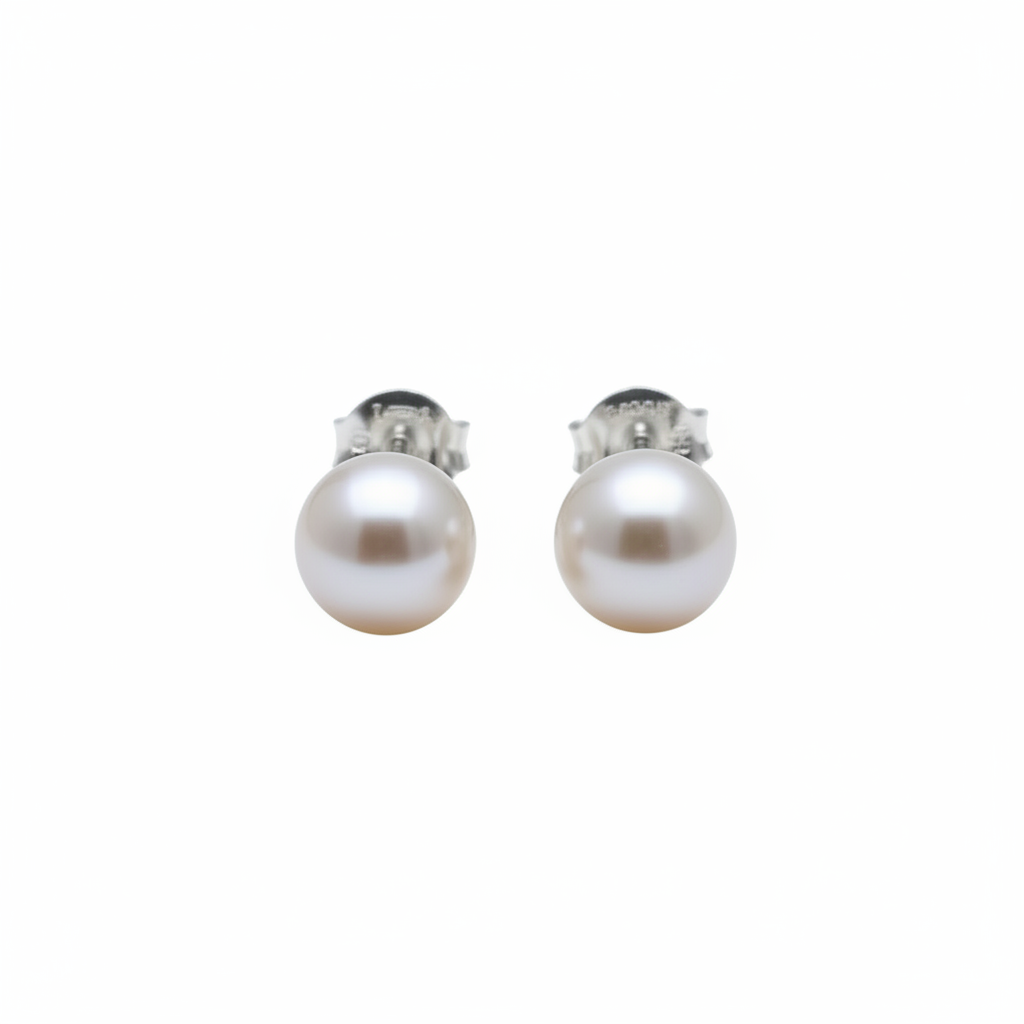 Pearl earrings isolated on white