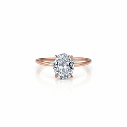 Rose gold moissanite ring with white background