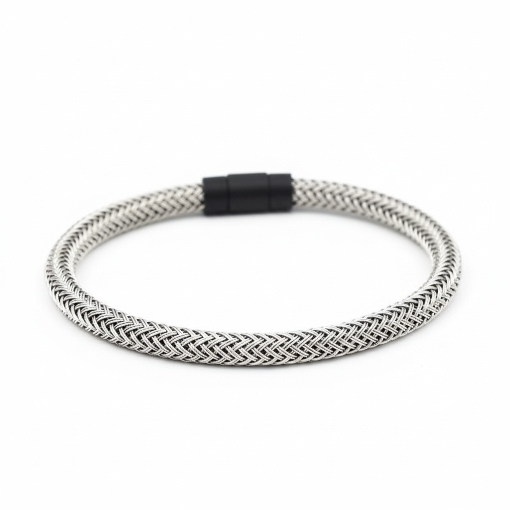 Silver braided bracelet on white background