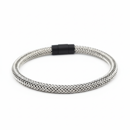 Silver braided bracelet on white background