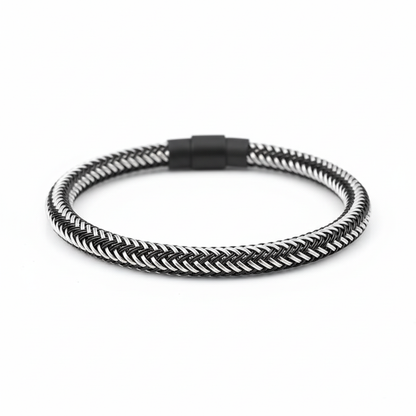 Silver braided bracelet on white background