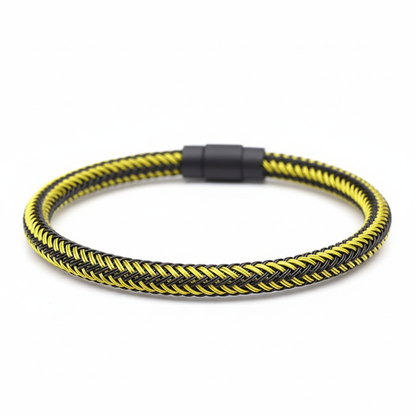 Yellow and black braided bracelet on white background